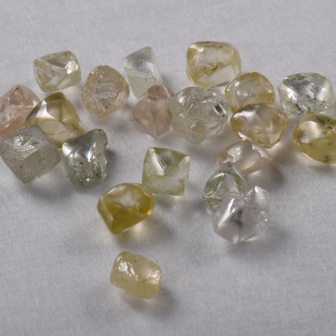 Natural rough diamond octahedra in white and fancy tints
