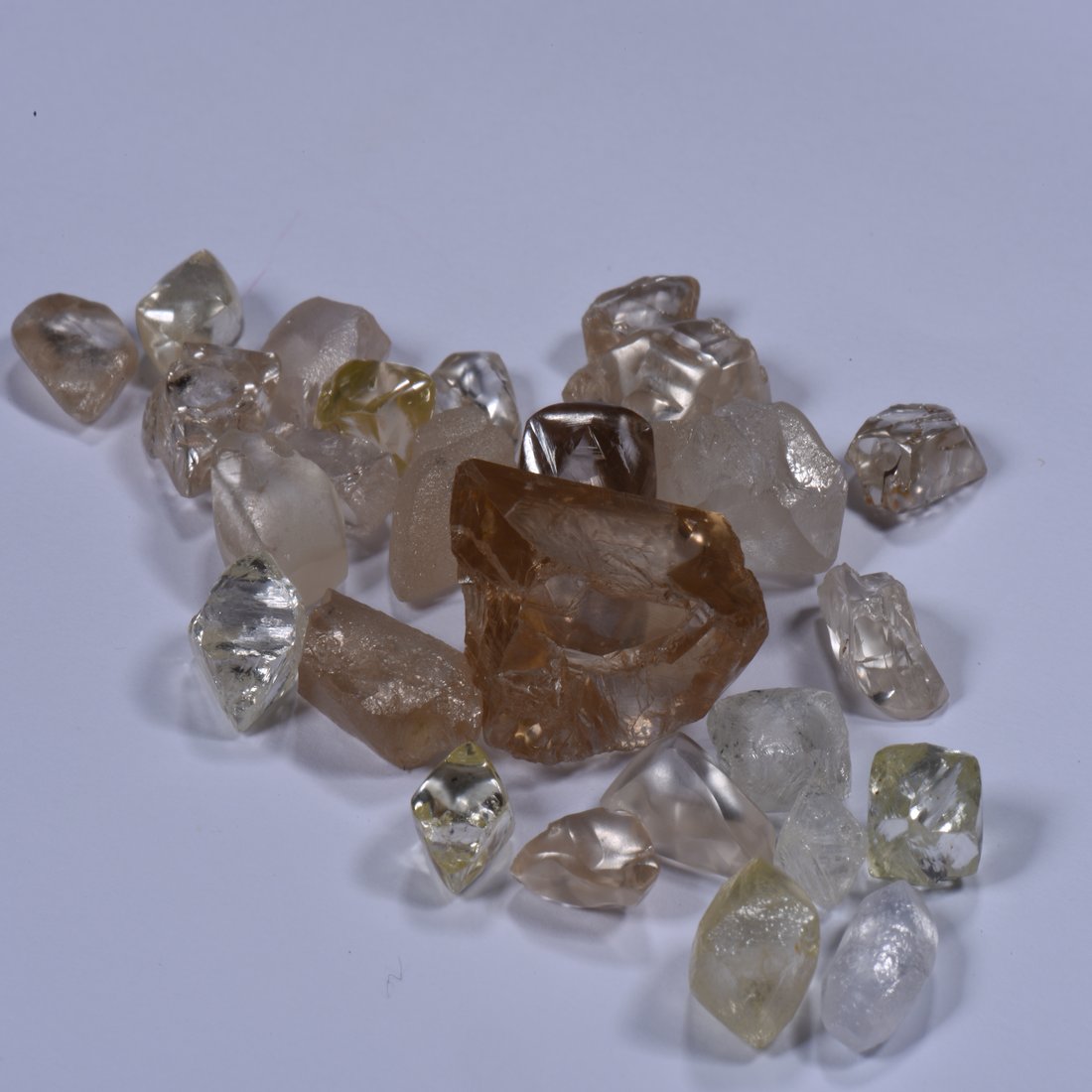 Uncut diamond crystals, cognac and colourless